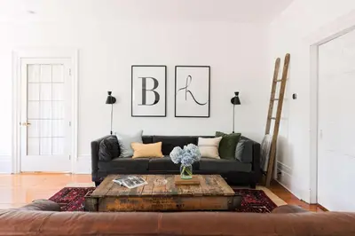 a living room with a couch and a coffee table at Babcock-Hubbs House in Carrying Place