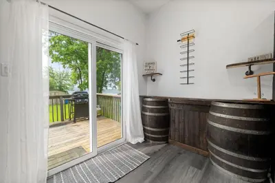 a room with a large sliding glass door with a deck at Lake lodge 6 in Frankford