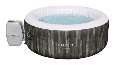 a bath tub with a pool of water in it at Instaworthy Home - Relaxing Patio - Hot tub & BBQ in Cambridge