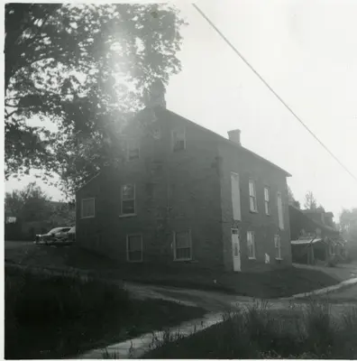 a black and white photo of a large house at The Wynford Elora The Monroe Suite in Elora
