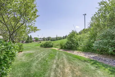 a dirt road in a park with trees and grass at Blue Mountain Haus - Private Patio - Walk to Blue in Blue Mountains