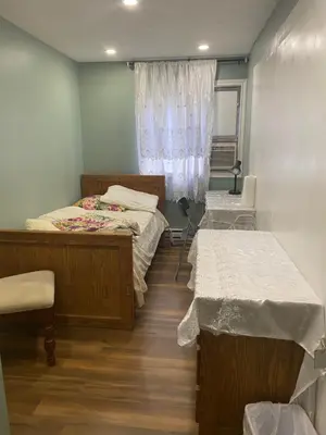 a room with two beds and a window at Peaceful and Private Room in Brampton