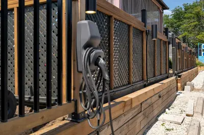 a bike is hooked up to a fence at Adrian's Suites 2 Bedroom Family Suite in Wasaga Beach