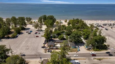 an aerial view of a parking lot next to the beach at Adrian's Suites 1 Bedroom Junior Suite in Wasaga Beach