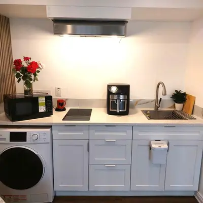 a kitchen with a sink and a microwave at Compact,1BR Guesthouse Studio in Guelph