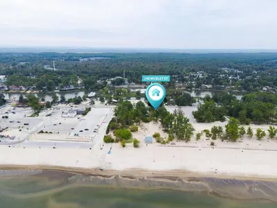 an aerial view of a parking lot with a street sign at Adrian's Suites 1Bedroom Junior Suite in Wasaga Beach
