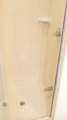 a bathroom with a shower with a glass door at Pantages Skyline Suite in Toronto Centre - Free Parking in Toronto
