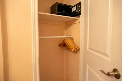 a bathroom door with a toaster and a microwave at Stylish 2BR Home with Front Yard and Free Parking in Toronto
