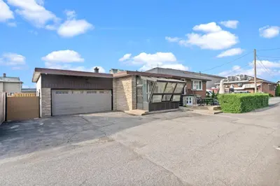 an empty driveway in front of a house at Beautiful home, a few minutes to the waterfall and attractions in Niagara Falls