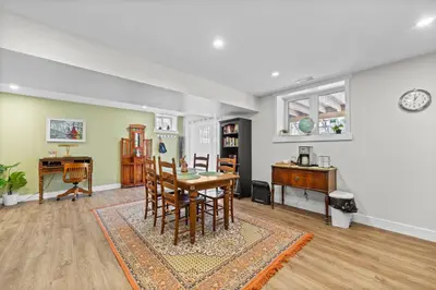a dining room with a table and a desk at Family-Friendly 2BR Near Lake & Downtown in Cobourg