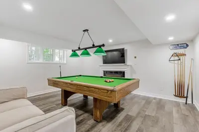 a living room with a pool table in it at Innisfil retreat, hot tub, Sauna, EV plug, Generac in Innisfil