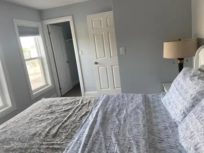 a bedroom with a large bed and a window at Rock place in Niagara Falls