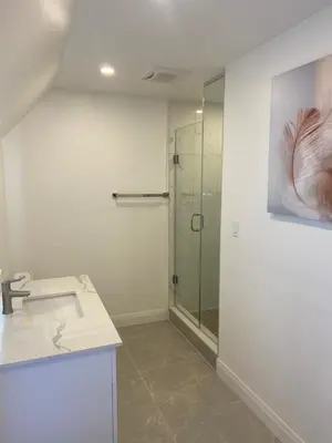 a bathroom with a sink and a glass shower at Rock place in Niagara Falls
