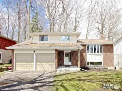 a large white house with a garage at HB GUEST HOME 2-entire house U3 beds in Waterloo