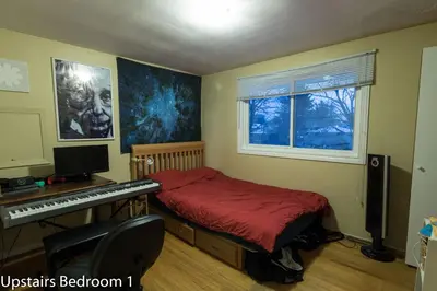 a bedroom with a bed and a desk with a keyboard at HB GUEST HOME 2-entire house U3 beds in Waterloo