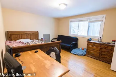 a bedroom with a bed and a desk and a table at HB GUEST HOME 2-entire house U3 beds in Waterloo