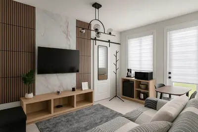 a living room with a couch and a flat screen tv at Vellore's Ritz and Rest House in Vaughan