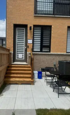 a house with stairs and a porch with two chairs at Vellore's Ritz and Rest House in Vaughan