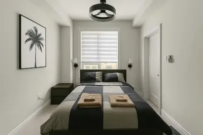 a bedroom with a large bed with towels on it at Vellore's Ritz and Rest House in Vaughan