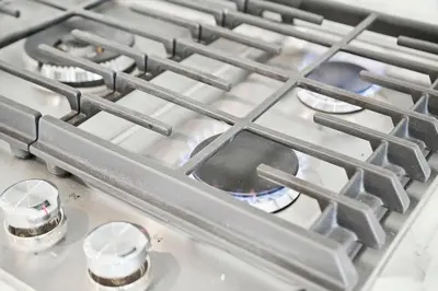 a stove top with many metal elements on it at Quiet Getaway Perfect for Families and Retreats in Mississauga