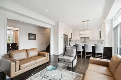 a living room with a couch and a table at Quiet Getaway Perfect for Families and Retreats in Mississauga