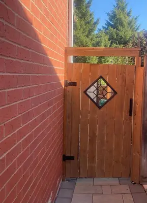 a wooden door with a stained glass window at Cozy Two-Bedroom Luxury Suite near Toronto Airport in Mississauga