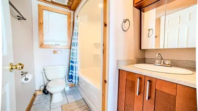 a bathroom with a toilet and a sink at Muskoka Lakefront 3-bdrm Chalet #90 in Port Carling