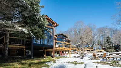 a cabin in the woods with snow on the ground at Muskoka Lakeview Cottage - Pier 100 #40 in Port Carling