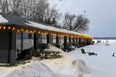 a building covered in snow with lights on it at 1-bedroom Townhouse in Harwood #2 in Harwood