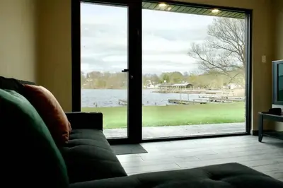 a living room with a couch and a large sliding glass door at 1-bedroom Townhouse in Harwood #5 in Harwood
