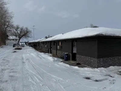 a snow covered building with a snow covered roof at 1-bedroom Townhouse in Harwood #5 in Harwood