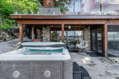 a bed is sitting on top of a patio at Lakefront cottage with golf area BBQ pool table in Bobcaygeon