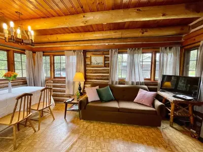 a living room with a couch and a table at 2-Bedroom - Balsam Lake Cottages Resort #12 in Kawartha Lakes