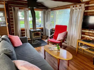 a living room with a couch and two chairs and a tv at Balsam Lake - 2-Bedroom Cottage #6 in Kawartha Lakes