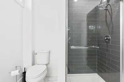 a bathroom with a toilet and a shower at RentX Cozy Downtown London Parking WiFi in London
