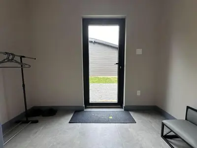 an empty room with a door leading to a garage at 3-bedroom Villa in Lakefield #17 in Lakefield