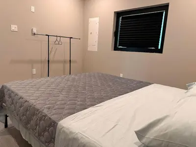 a large bed in a bedroom with a window at 3-bedroom Villa in Lakefield #11 in Lakefield