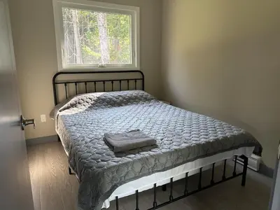 a bed in a bedroom with a window at 3-bedroom Villa in Lakefield #15 in Lakefield