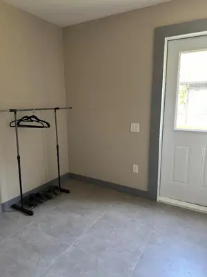 an empty room with a window and a door at 3-bedroom Villa in Lakefield #15 in Lakefield