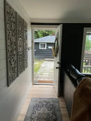 a hallway with a door leading to a house at The Muskoka Nest in Utterson