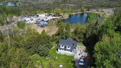 an aerial view of a house with a parking lot at 5-bedroom Villa in East Gwillimbury in East Gwillimbury