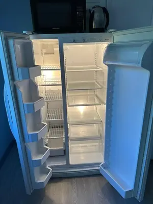an empty refrigerator with its door open in a room at 5-bedroom Villa in East Gwillimbury in East Gwillimbury