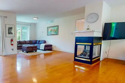 a living room with a fireplace and a tv at Monterra in Collingwood