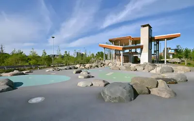 a building with rocks in front of a building at Stylish & Pet-Friendly 2BR Suite in Trendy Leslieville with Portable AC Nearest Intersection Eastern Ave in Toronto