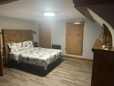 a bedroom with a bed and a window at Maple Falls Oasis By Tig Management in Niagara Falls