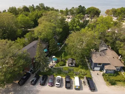 an overhead view of a yard with cars parked in a driveway at The Beach House - Steps to Beach Area 3 4BR in Wasaga Beach