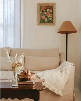 a living room with a couch and a table at The Wild Rose - Cozy PEC Rental in Picton in Picton