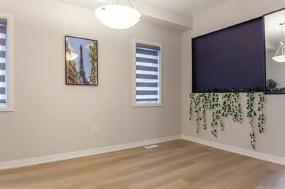 a room with a wall with a plant on it at 4Bed25 BathBrand newNiagara FallsSleeps12 in Thorold