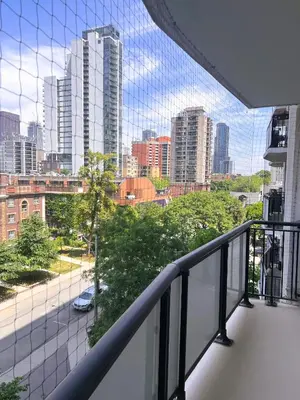 a balcony with a view of a city at The Charming Downtown Stop in Toronto