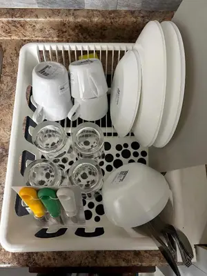 a tray filled with pots and pans in a sink at Chapman H in Toronto